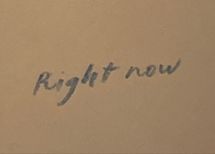 the word right now written in black ink