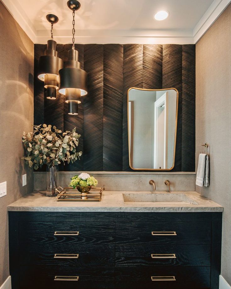 a bathroom vanity with two sinks and a mirror on the wall above it is decorated with flowers