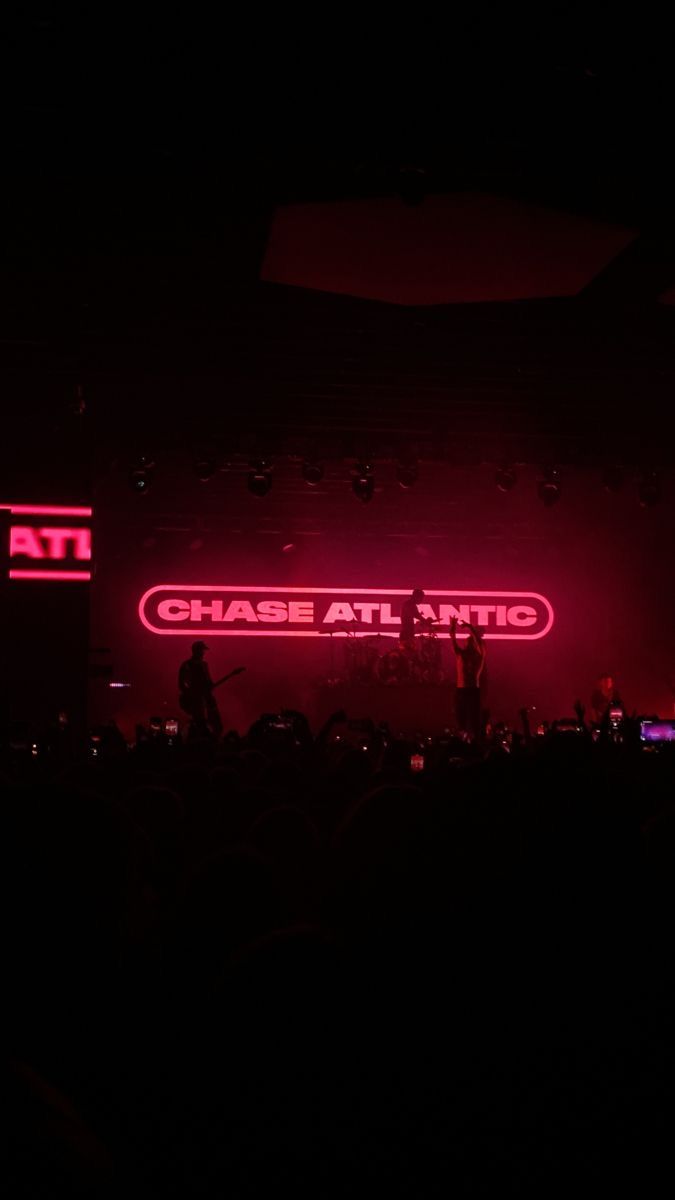 the stage is lit up with red lights