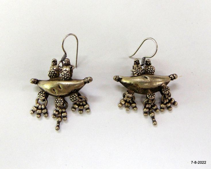 "Vintage antique tribal old silver earring pair from rajasthan India. Great workmanship original old worn pair in good condition. Best gift item. Note - Please check pictures carefully for more detail. Length - 5 cm (1.95\") Width side to side - 3.3 cm (1.3\") Weight of pair - 18 grams Material - Silver & original old worn pair." Vintage Silver Plug Earrings For Festivals, Vintage Silver Danglers For Festivals, Traditional Antique Silver Oxidized Earrings, Traditional Silver Oxidized Plug Earrings, Traditional Metal Earrings With Antique Finish, Traditional Antique Silver Earrings With Oxidized Finish, Traditional Silver Plug Earrings With Oxidized Finish, Traditional Silver Danglers For Rituals, Vintage Silver Brass Danglers