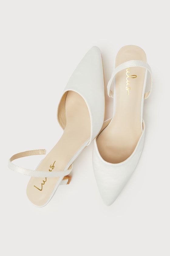 Your favorite going-out heels just dropped, and the Lulus Leith White Satin Kitten Heel Slingback Pumps are ready to get the party started whenever you are! Keep things ultra-chic with these sleek satin pumps that feature a single sole silhouette, a classy pointed-toe upper with a low-cut collar, and a slender slingback strap (with a bit of elastic at the side for fit). A trendy kitten heel completes the iconic design. 2. 5" wrapped kitten heel. Cushioned insole. Felted rubber sole has nonskid m Low Heel Slingback Pumps With Wrapped Heel For Party, Spring Event Slingback Pumps With Open Heel, Chic Slingback Kitten Heels For Wedding, Wedding Slingback Kitten Heels With Heel Strap, Chic Wedding Slingback Kitten Heels, Wedding Kitten Heels With Heel Strap And Slingback, Chic Low Heel Slingback Sandals For Wedding, Chic Slingback Pumps With 4-inch Heel For Events, Chic Slingback Sandals For Wedding