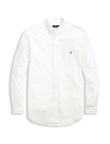 Preppy perfection. Classic oxford shirt is styled with a button-down collar, center back pleat, barrel cuffs, and shirttail hem. Finished with Ralph Lauren's signature embroidered pony at the chest. 100% cotton. Machine wash. Imported. Machine wash; imported Classic Button-up Dress Shirt For Spring, Classic Spring Button-up Dress Shirt, Classic Dress Shirt With Placket For Spring, Classic Spring Dress Shirt With Placket, Classic Spring Shirt With Placket, Preppy Long Sleeve Shirt For Daywear, Classic Spring Dress Shirt For Daywear, Classic White Shirt For Spring, Casual White Shirt With Fold Down Collar