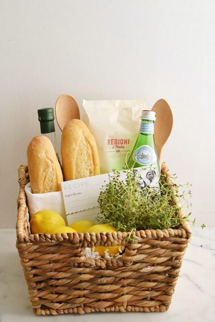 a basket filled with bread, lemons and other items