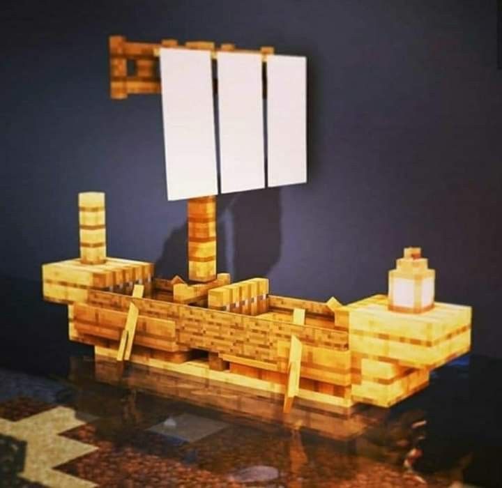 a wooden model of a boat with two mirrors on it's side and a lamp in the middle