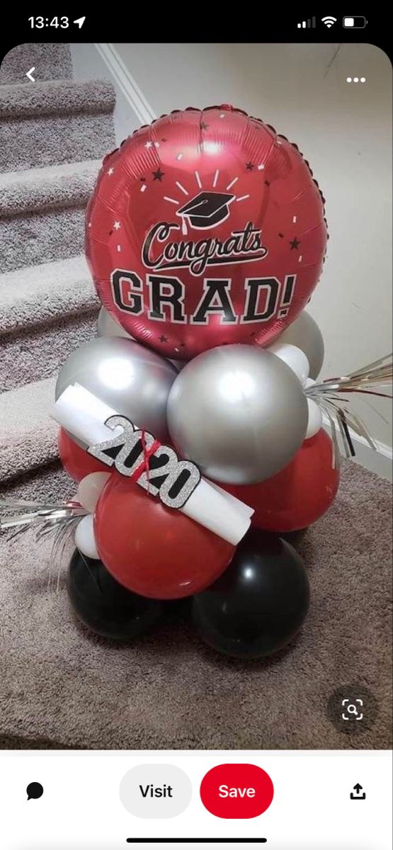 some balloons are stacked on top of each other in the shape of graduation caps and tassels