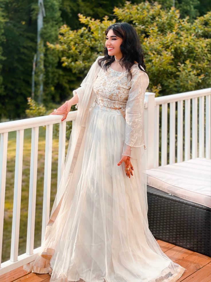 This white and gold lehnga choli is perfect for any occasion! The choli features golden work and the white lehnga is made from a shimmery cloth & stands out on its own.  . . . . . Please allow slight color and design variations, reach out to us if you would like a custom size made. White Anarkali Choli For Party, White Floor-length Bollywood Choli, White Floor-length Choli For Eid, White Semi-stitched Bollywood Choli, White Semi-stitched Choli With Sheer Dupatta, White Floor-length Choli With Sheer Dupatta, White Bollywood Choli With Zari Work, Festive White Gown With Dabka Work, White Gown With Dabka Work For Festive Occasions