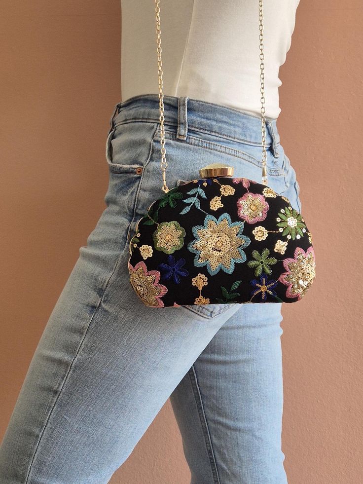 The Luna - our captivating designer clutch that will add a pop of color and elegance to your wardrobe! Embellished with delicate multi-colored floral embroidery, Luna is designed to make a stunning statement. This clutch boasts a unique oval shape and a secure metal clasp that ensures style and functionality. Elevate your accessory game with Luna's exquisite design. Bag dimensions: approx. 23 cm x 16 cm Carrying strap: approx. 120 cm Weight: approx. 350 g Material: Embroidered fabric (outside), Luxury Embroidered Multicolor Clutch, Multicolor Clutch For Evening In Spring, Spring Evening Clutch Embroidered, Spring Formal Clutch Pouch, Spring Evening Embroidered Clutch, Elegant Multicolor Clutch For Events, Summer Multicolor Embroidered Clutch, Floral Embroidered Evening Bags, Multicolor Summer Clutch Evening Bag