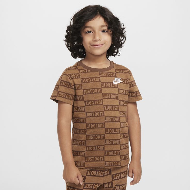 Made of soft cotton/poly jersey and featuring an allover knit pattern, this tee makes a statement. It has a tagless crewneck that creates a comfy feel and the classic cut is roomy enough for kids to move freely and Just Do It. Brown Jacquard Knit Crew Neck Top, Cotton Jacquard Knit Short Sleeve Tops, Casual Cotton Tops With Logo Pattern, Nike Casual Brown Tops, Casual Brown Nike Top, Crew Neck Cotton Tops With Logo Pattern, Nike Just Do It, Knit Pattern, Knit Patterns