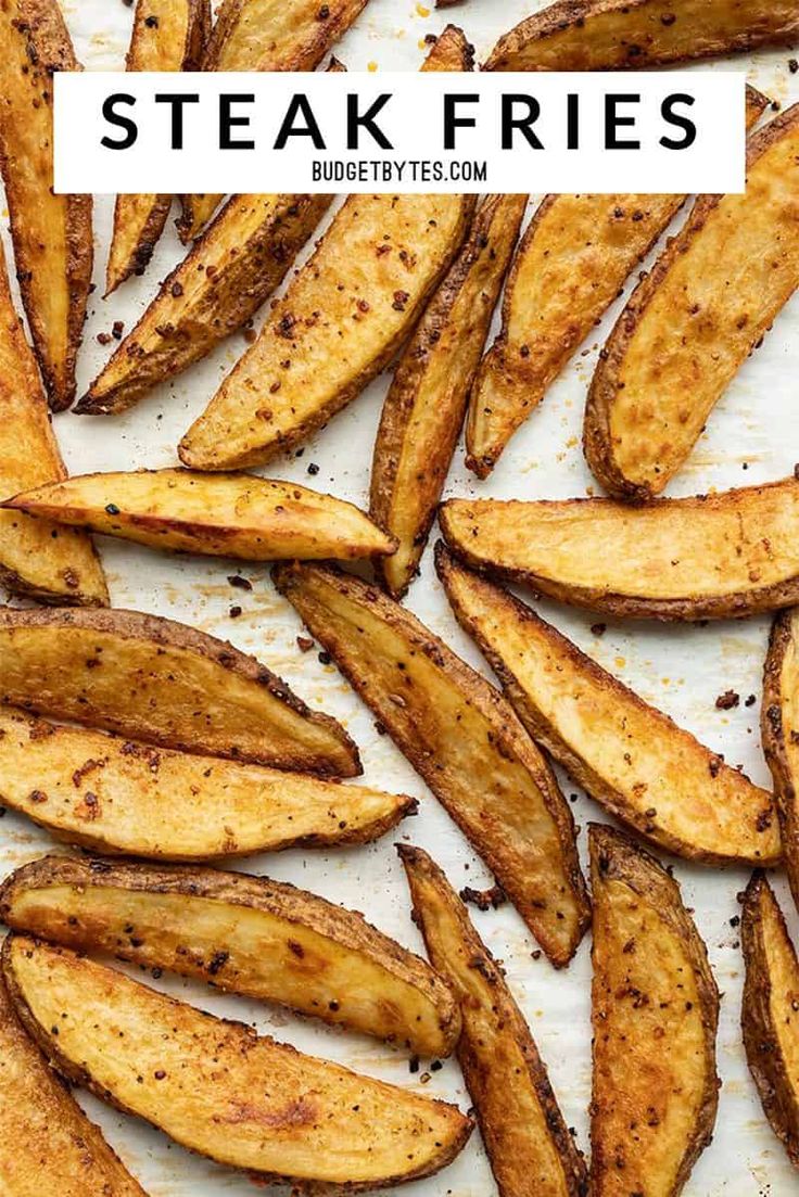 cooked steak fries on a white surface with text overlay that reads, steak fries