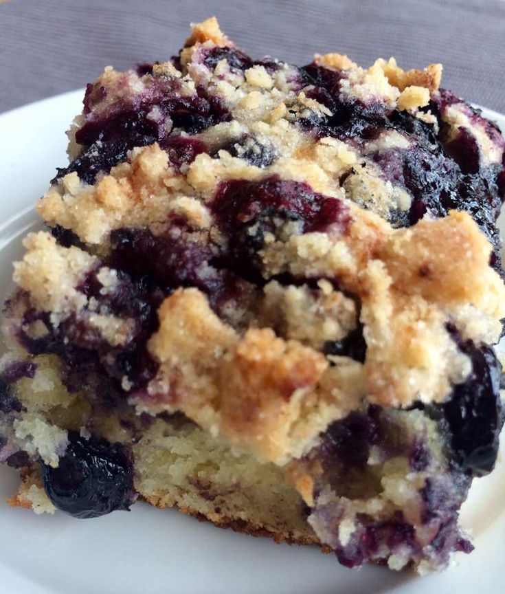 a piece of blueberry crumb cake on a plate