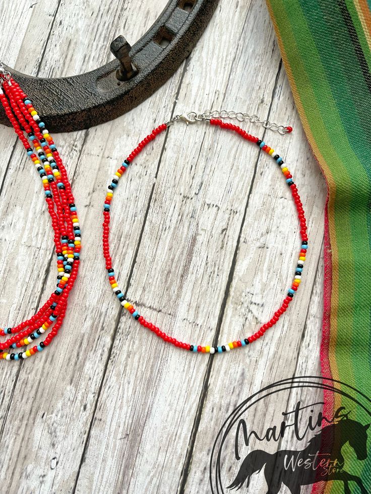 Red Serape Chocker Necklace Made with size 8/0 seed beads.  SIZE GUIDE  Ʊ  The Necklace is adjustable has a chain and pendant lobster clasp on the ends, which can easily adjust its length to fit your size. It closes to a minimum of 13" to a maximum of 16". Ʊ If your neck size is larger or smaller than the measurements above please leave a note at checkout of your neck size and I will be happy to customize the size for you. Ʊ How to measure your neck size: If you don't have a seamstress tape measure, take a piece of yarn or string and wrap it around your neck to a comfortable fit marking the point where the end touches itself. Lay the string straight next to a ruler and note the length. Ʊ  In the drop-down menu there is the option to buy the set of 2, 3 and 4 the same with a discount All Pr Seed Bead Necklace Western, Handmade Red Hippie Beaded Bracelets, Red Hippie Beaded Bracelets For Gift, Hippie Red Beaded Bracelet Gift, Southwestern Style Red Beaded Bracelets For Gift, Southwestern Style Red Beaded Bracelet As Gift, Festival Red Necklaces With Colorful Beads, Traditional Red Beaded Bracelets For The Beach, Traditional Red Beaded Necklaces For Beach