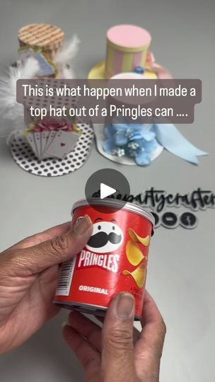 someone is holding up a can of pringles