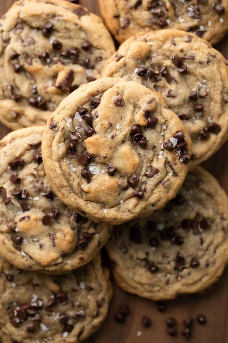 chocolate chip cookies are piled on top of each other