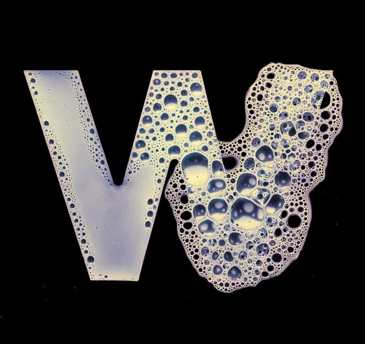 the letter w is made up of water droplets on it's surface and has an interesting shape