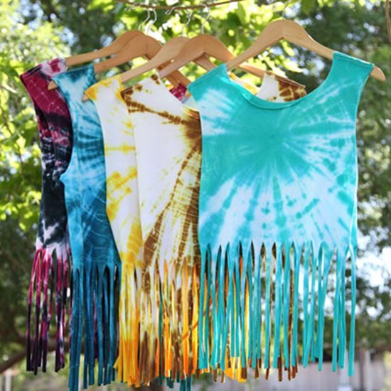 tie - dyed shirts hanging on a clothes line