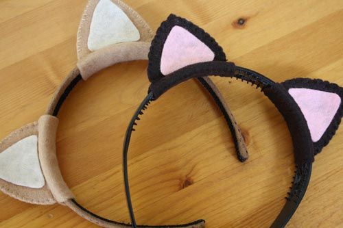 two cat ears on top of a wooden floor