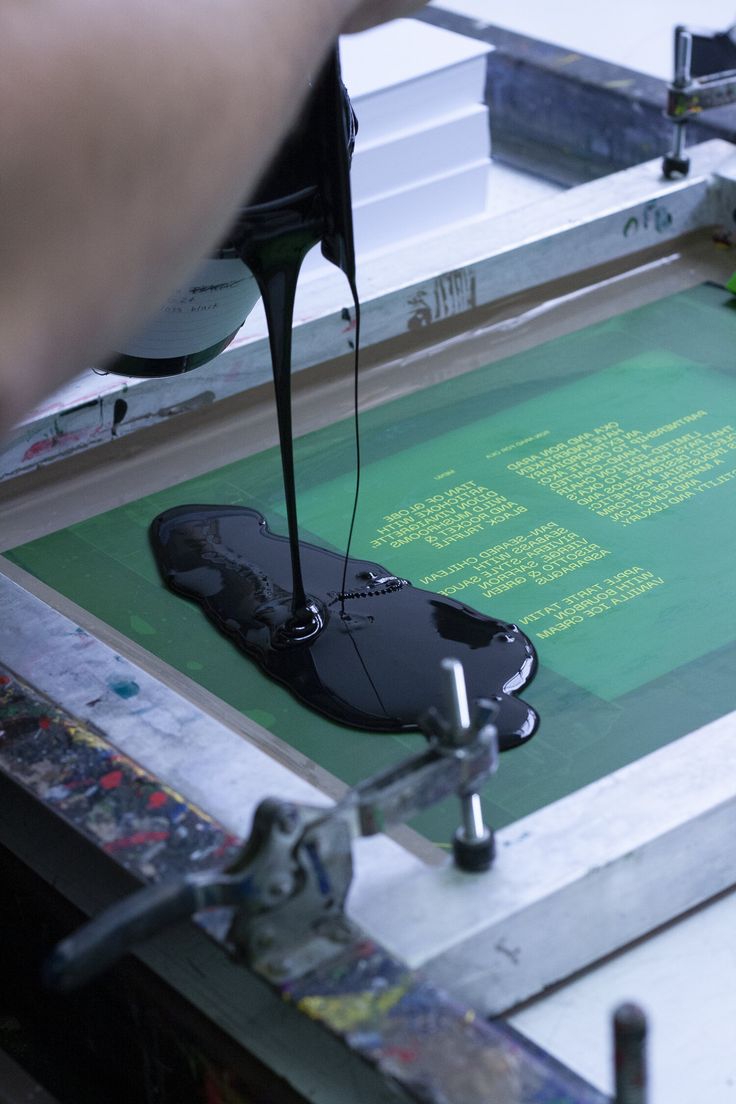 a computer mouse is being worked on by a person using a machine to print it