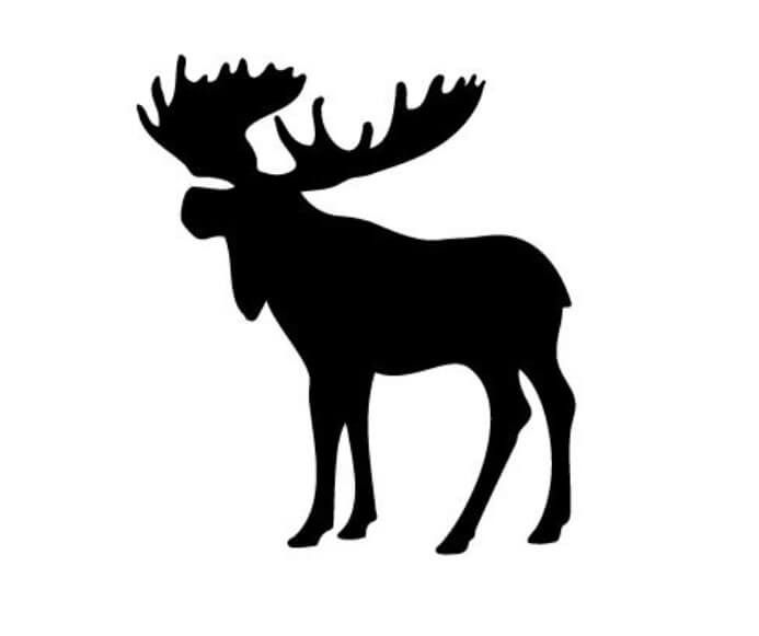 the silhouette of a moose with large antlers