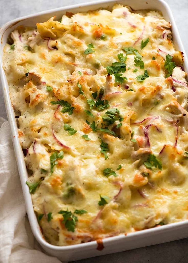 a casserole dish filled with chicken and vegetables