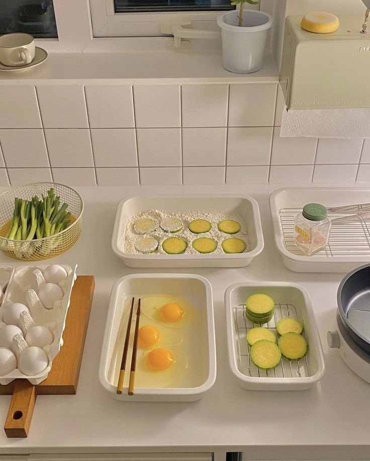 the kitchen counter is clean and ready for us to prepare their meal, including cucumbers