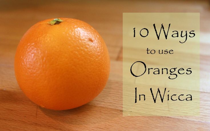 an orange sitting on top of a wooden table with the words 10 ways to use oranges in wicca