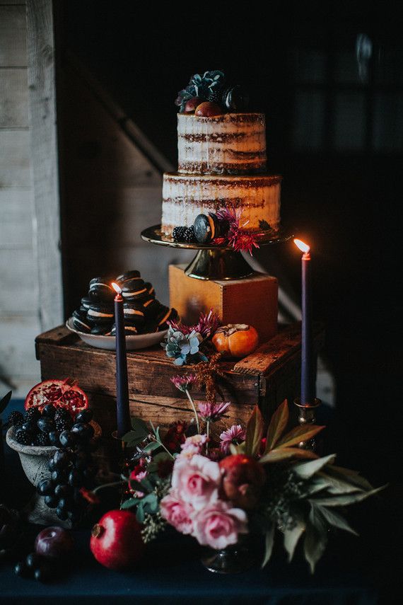 an image of a cake with candles and flowers on the table in front of it