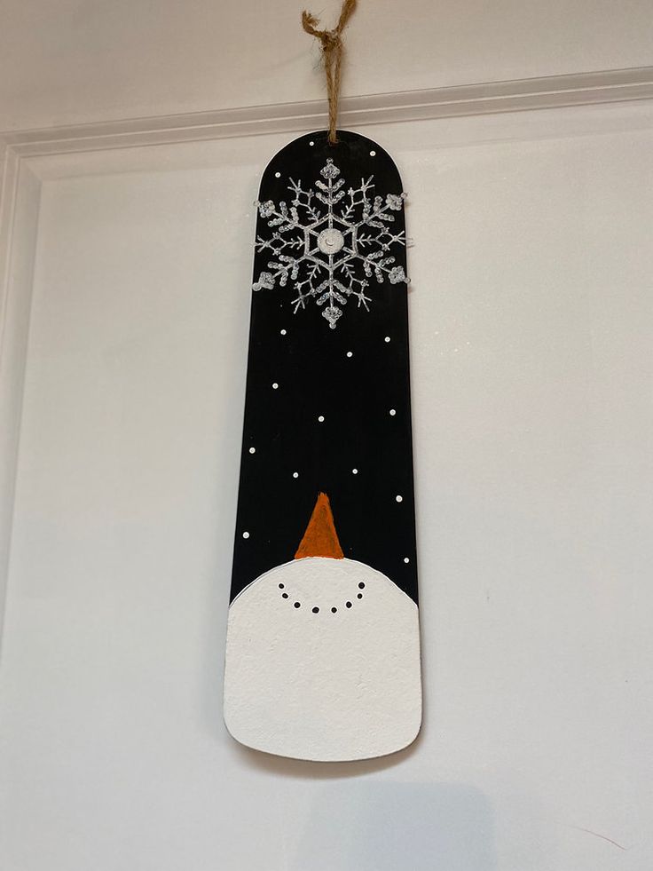 a snowman is hanging on the wall