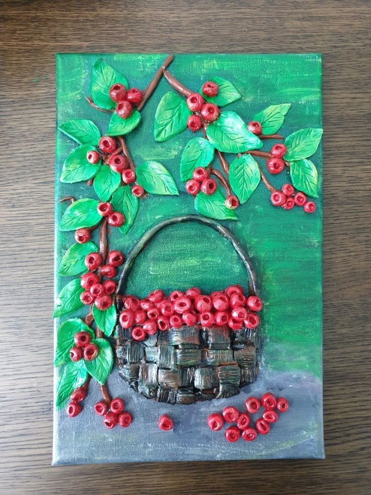 a painting with red berries on it and green leaves around the basket that is made out of wood