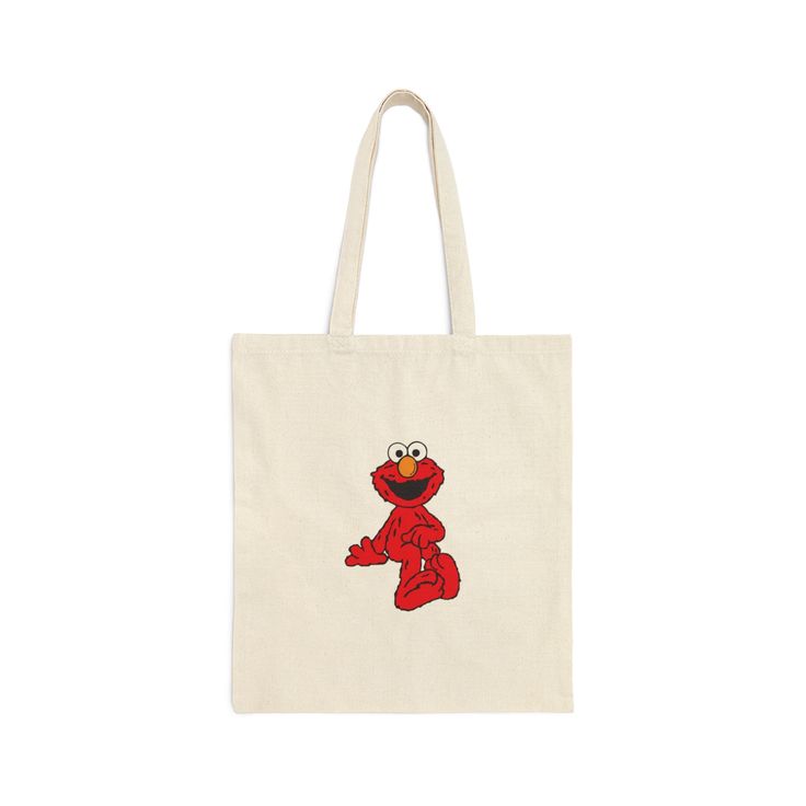 "Elmo Tote Bag measuring at 15.75\"h x 15.25\"w and with a handle length of 21.5\", these personalized tote bags are with 100% cotton sheeting." Cotton Canvas Shoulder Bag With Handles, Everyday Cotton Bag, Everyday Cotton Square Bag, Everyday Square Cotton Bag, Everyday Square Cotton Bags, Cotton Canvas Tote Bag With Handles, Rectangular Cotton Canvas Bag With Handles, Trendy Cotton Shoulder Bag With Handles, Square Cotton Shoulder Bag As Gift Bag