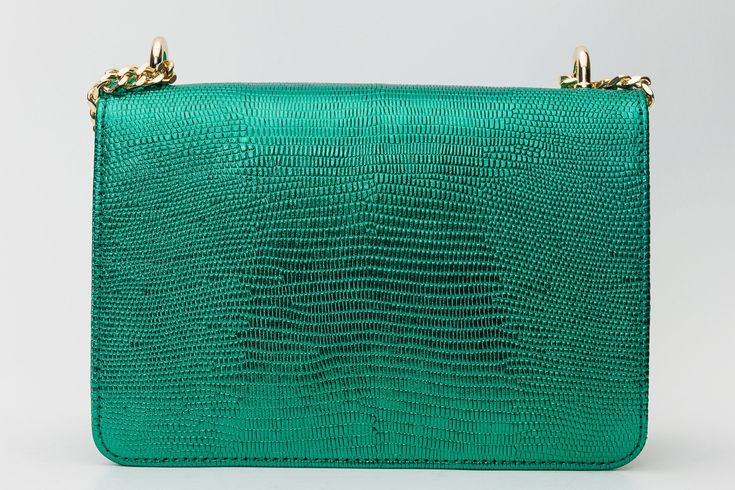 Length: 8" Height: 5" Width: 3.5" Full length of Strap: 54.5" Maple Green Metallic Leather Handbag: Timeless Elegance in a Lush Hue Supreme Metallic Leather Craftsmanship: Immerse yourself in timeless elegance with the Maple Green Metallic Leather Handbag, meticulously crafted from 100% high-quality metallic calf leather, ensuring an accessory that radiates sophistication in a lush green hue. Singular Splendor: Embrace modern simplicity with a single-compartment design, allowing the radiant meta Green Formal Bag, Elegant Green Formal Shoulder Bag, Designer Green Clutch For Formal Occasions, Designer Green Evening Bag For Formal Occasions, Luxury Green Formal Shoulder Bag, Luxury Green Evening Bag For Gifting, Luxury Green Evening Bag For Gift, Luxury Green Evening Bag, Luxury Green Rectangular Evening Bag