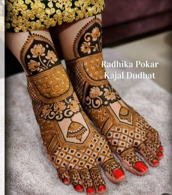 the feet are decorated with henna and flowers