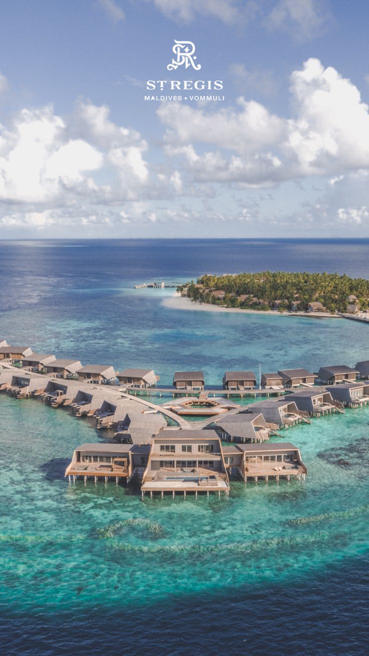 an aerial view of the overwater resort in the middle of the ocean with water surrounding it