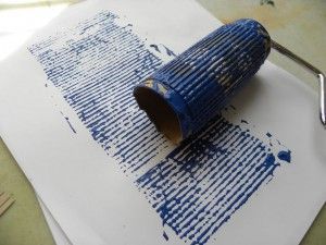 a piece of paper with blue paint on it