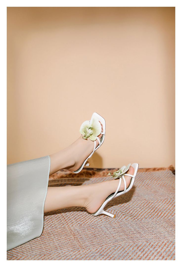 Helene Floral Heels in Green Helene is a graceful fusion of elegance and charm, crafted to elevate your style effortlessly. These heels feature delicate floral embellishments that bring a touch of nature-inspired beauty to your ensemble. The soft white color, combined with the intricate strappy design, exudes sophistication and refinement. Perfect for weddings, garden parties, or any event where you want to make a lasting impression, the Helene Floral Heels are a beautiful addition to any wardrobe. Details: - Delicate floral embellishment- Strappy design- Mid-height heel (7cm)- Square toe- Soft white color- Good Girl Things Elegant Days Collection Feminine Summer Wedding Shoes With 4-inch Heel, Elegant Spring Formal Heels, Elegant Formal Heels For Spring, Elegant Low Heel Spring Heels, Elegant Low Heel Heels For Spring, Spring Wedding Shoes With Ankle Strap, Feminine Wedding Sandals With Padded Heel, Spring Cream Open Toe Kitten Heels, Cream Open Toe Kitten Heels For Spring