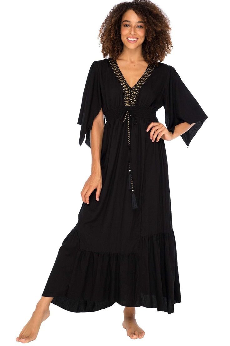 BEAUTIFUL BLACK MAXI SUNDRESS HAS A HAND BEADED DEEP V NECK, empire waist and ruffled bottom with a sophisticated, feminine style. The perfect summer dress for day or evening FLATTERING CAPE SLEEVES FLOW DOWN PAST THE ELBOW. Gold beaded tassels tie at the front accenting the comfortable elasticized empire waist, giving this boho inspired long casual beach dress, a comfortable, stylish fit LUXURIOUS AND BREATHABLE 100% HIGH-QUALITY RAYON HAS A SOFT, SILKY FEEL ON THE SKIN. Wear this sexy plunging Black Maxi Sundress, Plunging V Neck Dress, Flowy Sundress, Casual Beach Dress, Long Summer Dresses Maxi, Long Sundress, Blue Party Dress, Party Dresses Online, Summer Black Dress