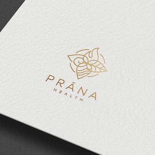 the logo for prana health is shown on top of a white card with gold foil