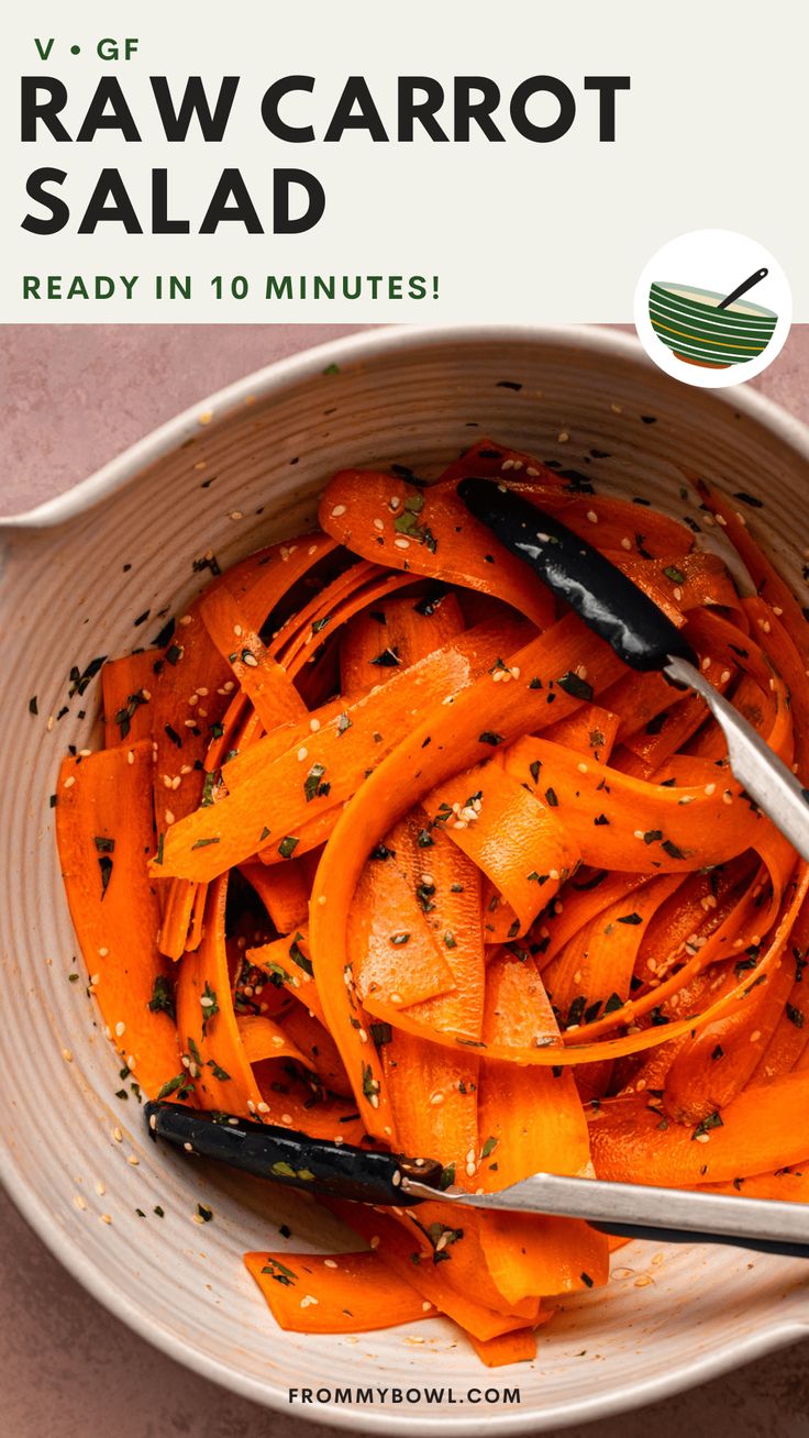 a white bowl filled with sliced carrots on top of a table