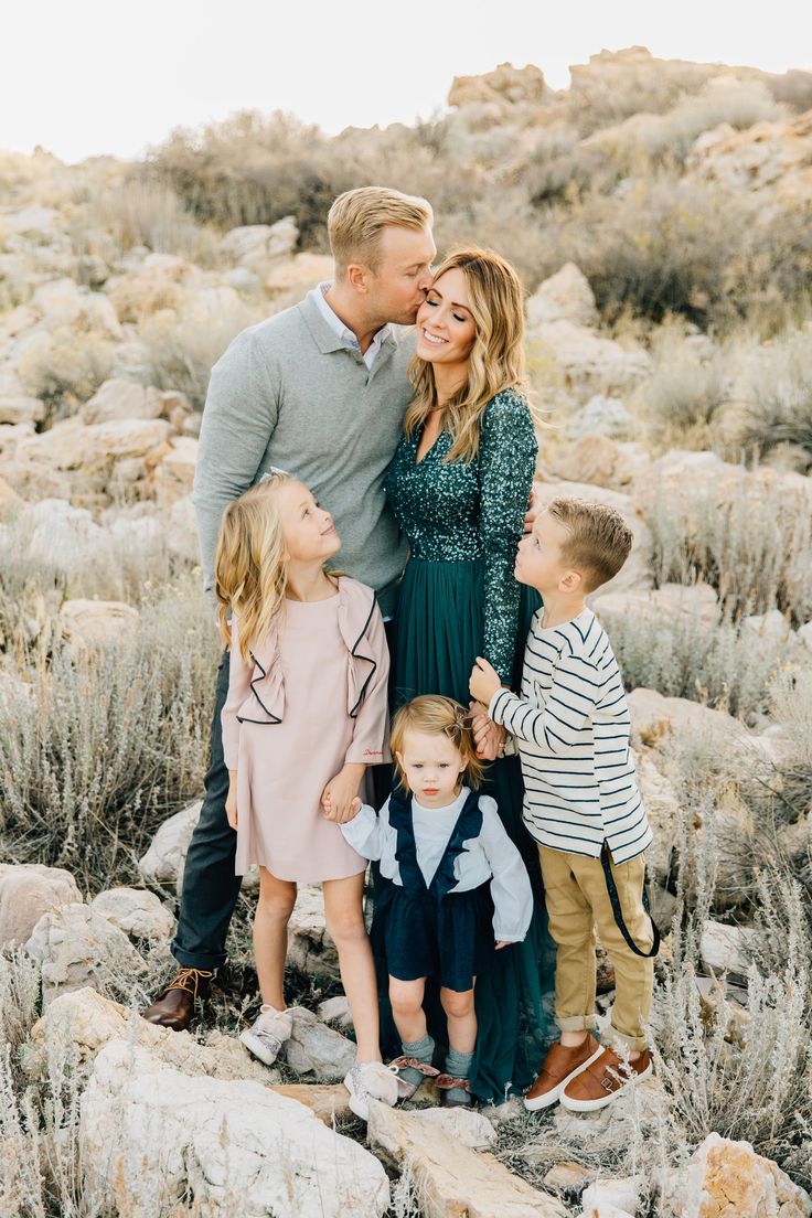 a family poses for a photo in the desert