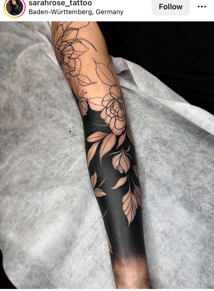 a person with a flower tattoo on their arm