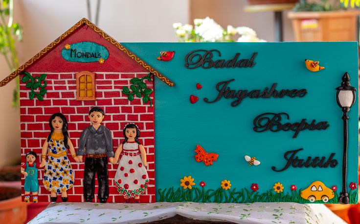 there is a cake that looks like it has been made to look like a family