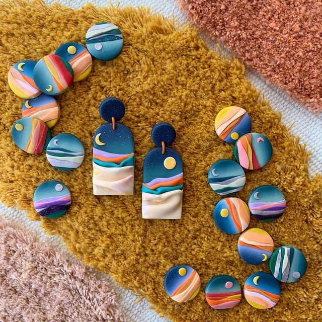 some colorful buttons are laying on a rug