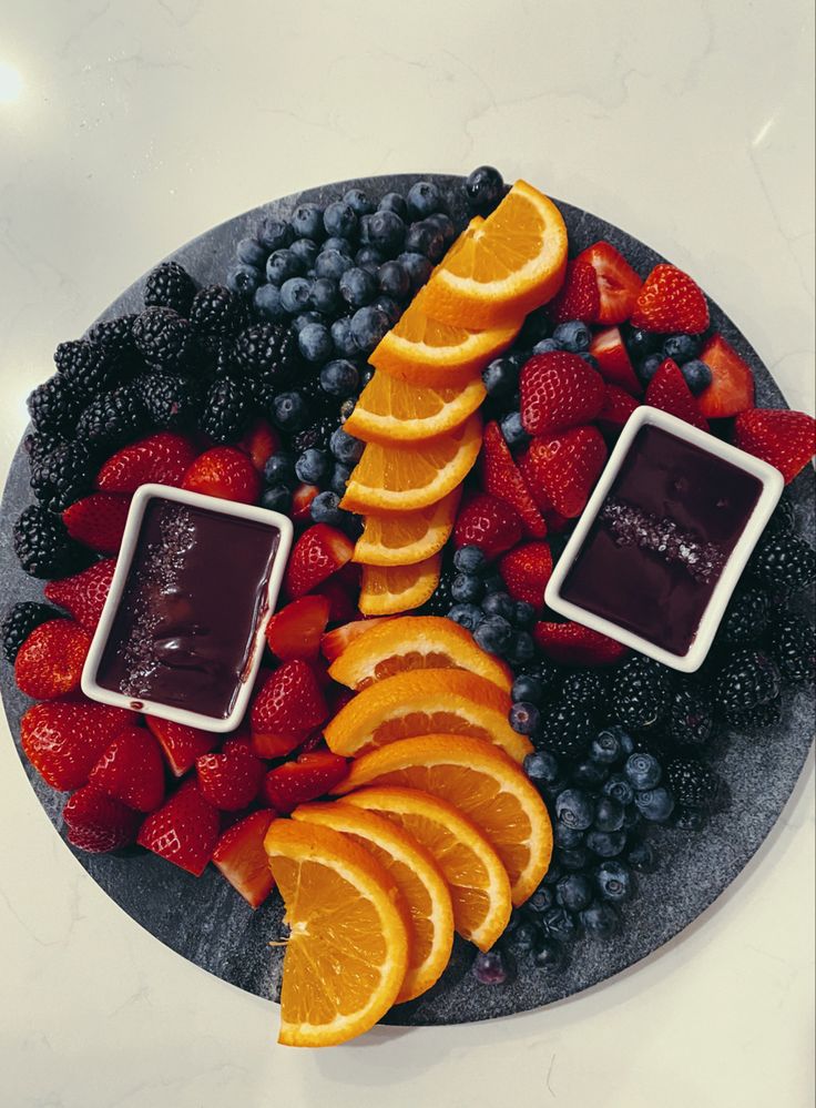 fruit platter with oranges, strawberries and blueberries