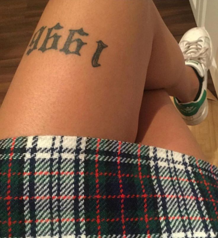 a person with a tattoo on their leg