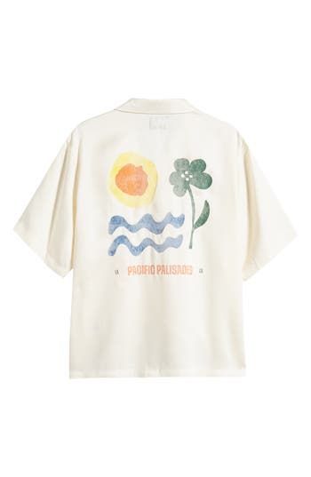 Colorful flowers pair with sun-and-surf artwork on a camp shirt made of silky lyocell and styled to keep you relaxed on warm, casual days. 27 1/2" length; 48" chest (size Medium) Front button closure Convertible collar Short sleeves 100% lyocell Machine wash,  dry flat Imported Surf Artwork, Convertible Collar, Summer Wardrobe Essentials, Wedding Guest Shoes, Pacific Palisades, Sneaker Slippers, Pajama Robe, Camp Shirt, Baby Boy Shoes