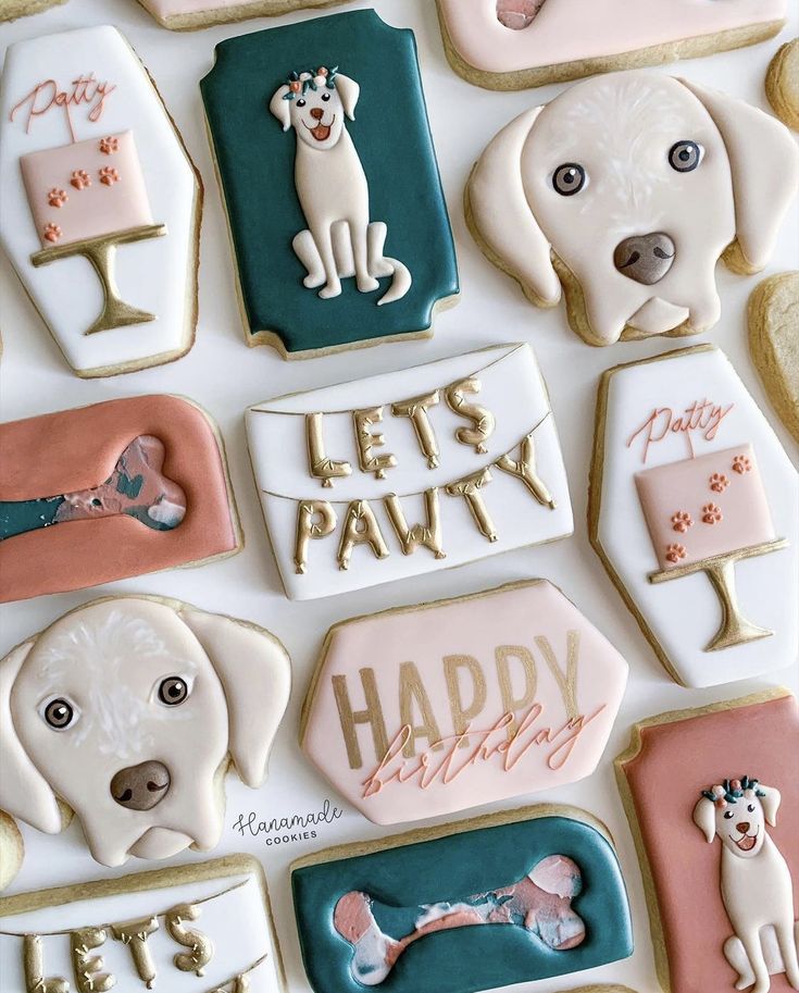 decorated cookies with dogs and letters on them