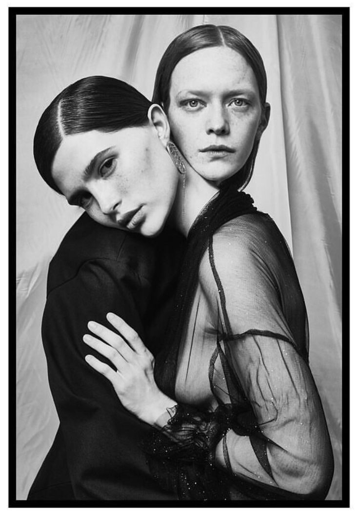 black and white photograph of two women hugging each other