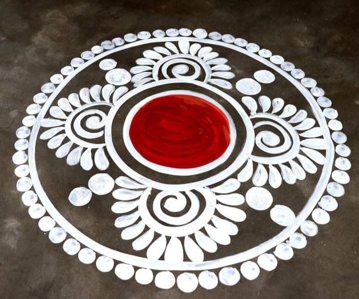 a white and red circular object with circles on the floor in front of black background