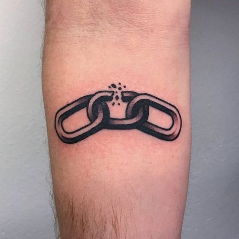 a man's arm with a chain tattoo on it