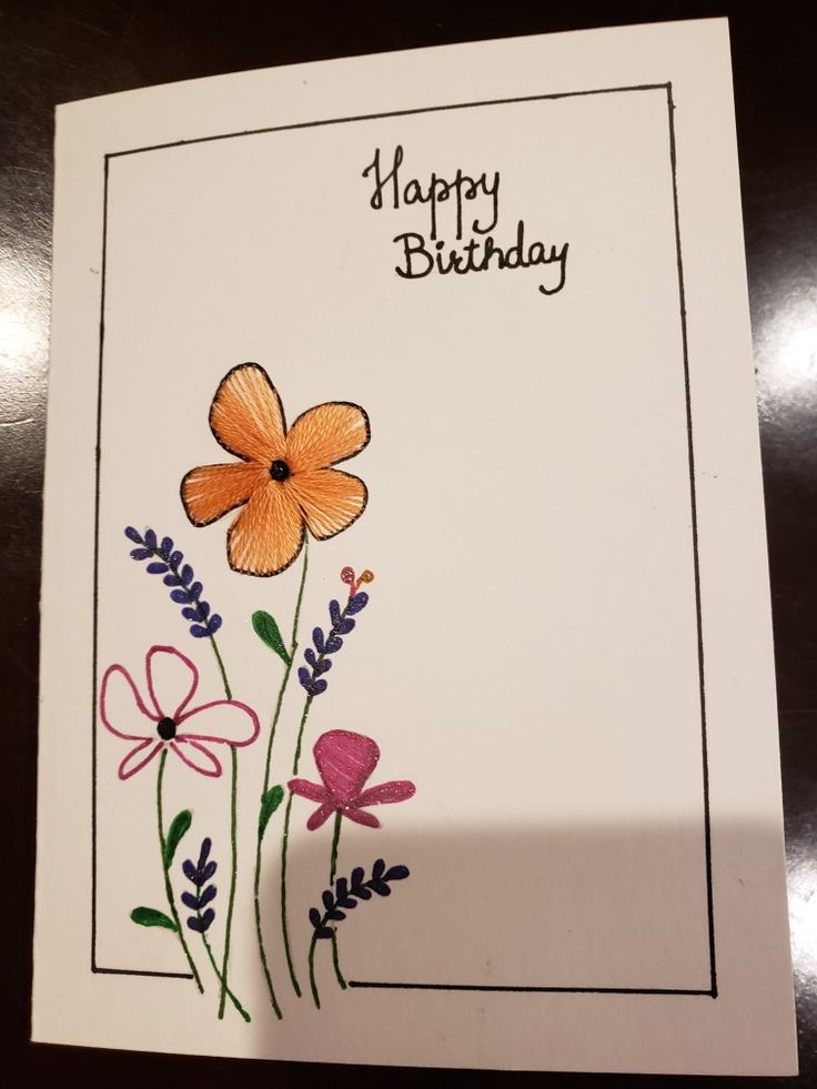 a birthday card with flowers on it