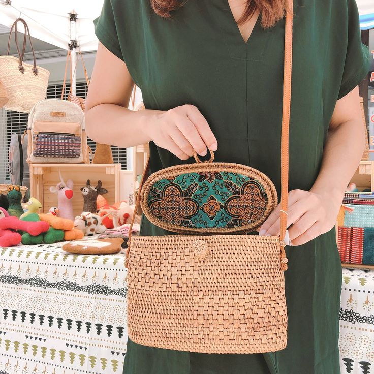 Exude timeless elegance with the Bali Rattan Crossbody Bag - Postman Messenger Bag. Crafted from the finest Ata grass and real leather, this handcrafted piece features a compact yet practical design. The adjustable strap, made from nude real leather, allows for effortless carrying of your essentials in style. This bag gracefully sits at your side, complementing your outfit with sophistication. Natural Clutch Shoulder Bag With Leather Handles, Natural Satchel With Mobile Phone Bag For Daily Use, Natural Straw Crossbody Bag With Phone Pocket, Eco-friendly Brown Clutch Shoulder Bag, Crossbody Straw Bag With Adjustable Strap As Gift, Natural Pouch Satchel With Adjustable Strap, Natural Color Clutch Shoulder Bag With Detachable Strap, Natural Straw Pouch Bag With Detachable Strap, Natural Color Clutch Bag With Adjustable Strap